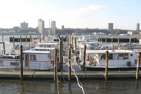 Floating berths with houseboats moored alongside
