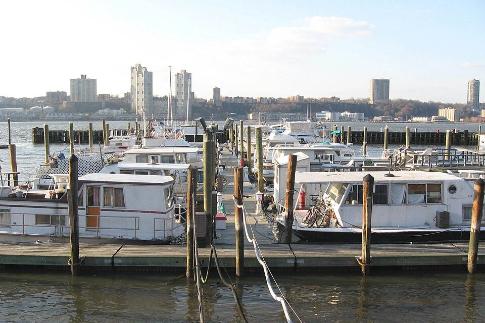 Floating berths with houseboats moored alongside